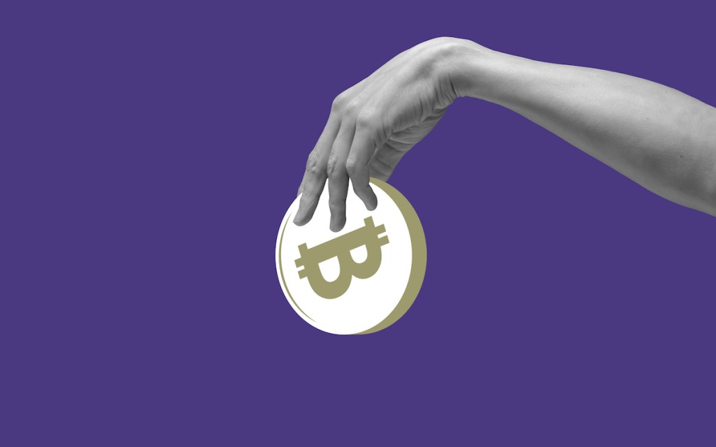 Hand holding a large abstract bitcoin against a purple backdrop, used in a post about Zipmex