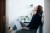 Woman sitting on the floor of her bedroom with laptop, used in post about Asian mental health startup Intellect
