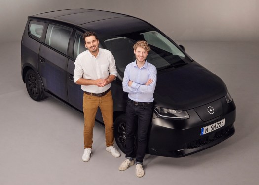 Sono Motors co-founders Jona Christians and Laurin Hahn posing in front of Sion EV