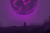 An image of the web3 video game Project Nightshade with a character looking up at an exploding orb