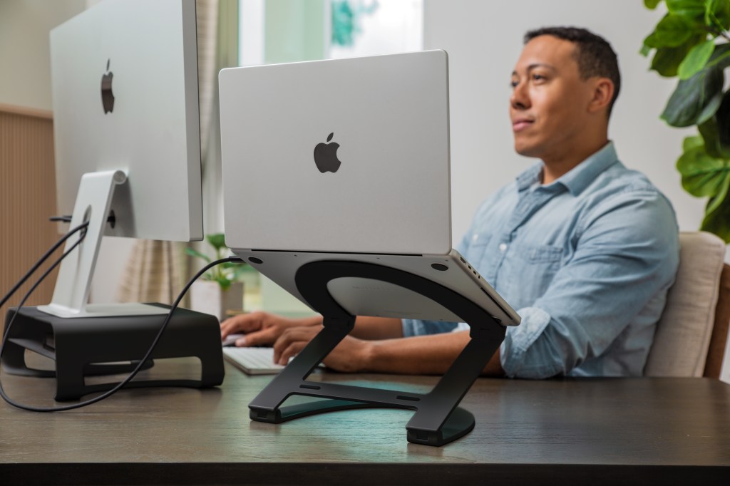 laptop on stand, on desk