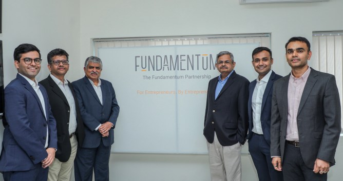 6 men standing in office
