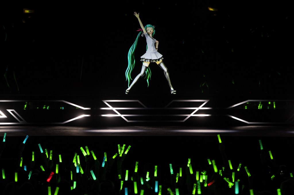 Hatsune Miku, a proto VTuber, performs for an audience