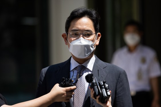 man standing at press conference