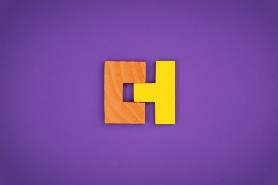 Perfectly Fit Together Concept With Wood Block Puzzle; getting acquired startup building