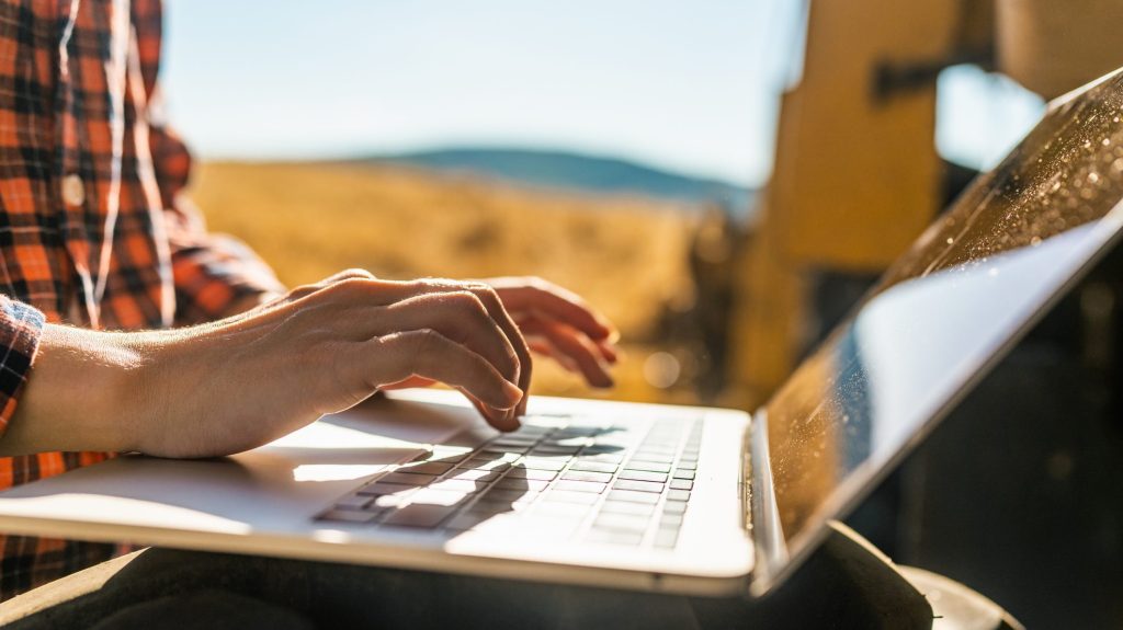 working outdoors on laptop