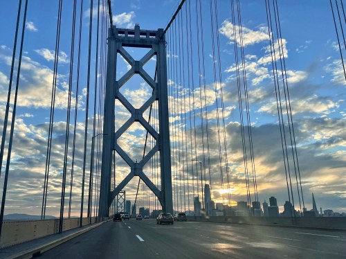 View of the San Francisco skyline from the Bay Bridge during sunset in Winter 2022.