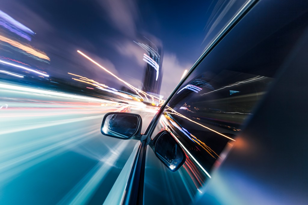 View from Side of Car Going on the road, Blurred Motion,Focus on the mirror.adobe rgb 1998 use...........