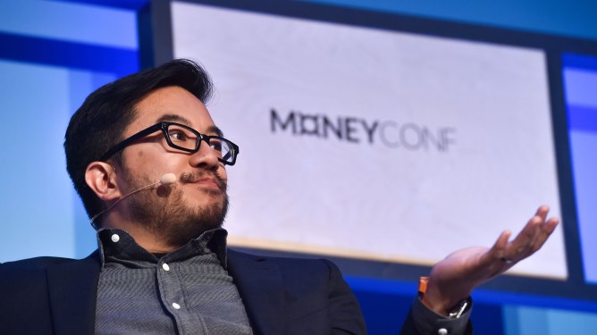 Garry Tan gestures at MoneyConf