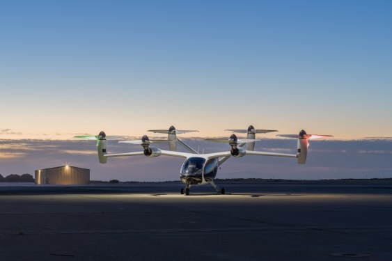 electric vertical takeoff and landing vehicle at a marina at sunset