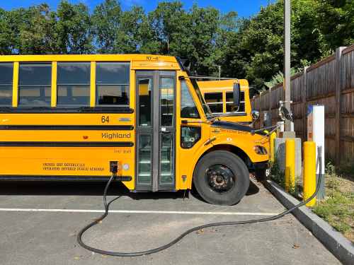 A school bus connected to a V2G charger