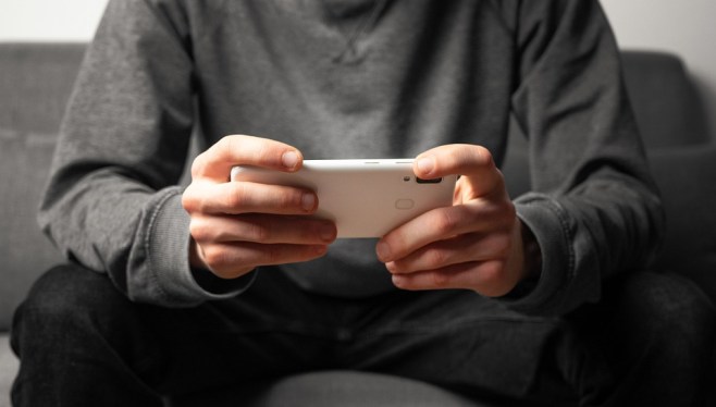 person looking at smartphone