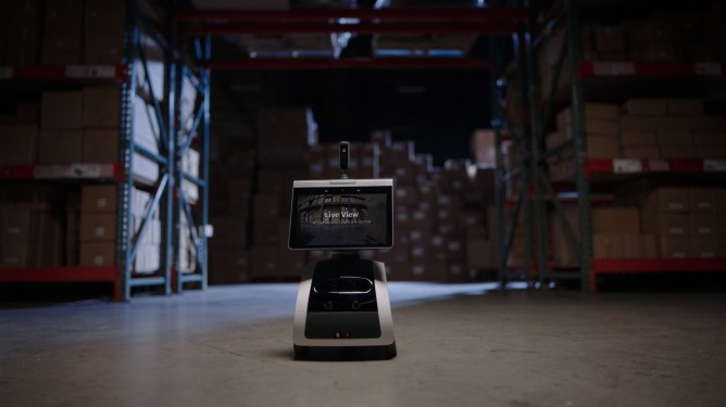 security robot patrolling warehouse
