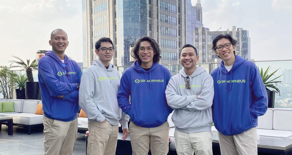 5 men standing on highrise balcony