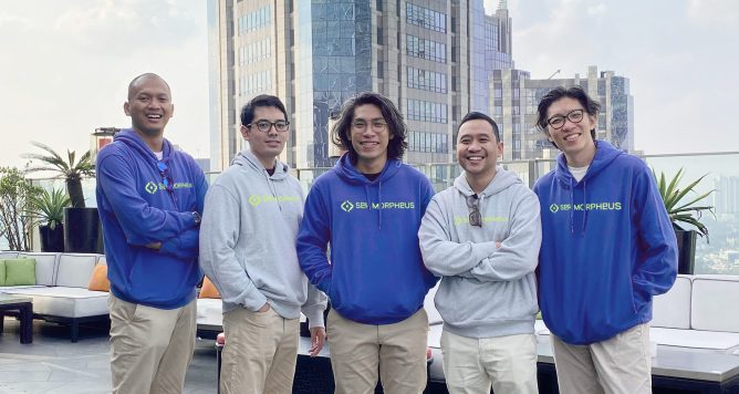 5 men standing on highrise balcony