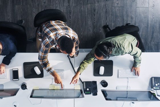 High angle shot of people working the phones in an office, used in a post about Nektar.ai