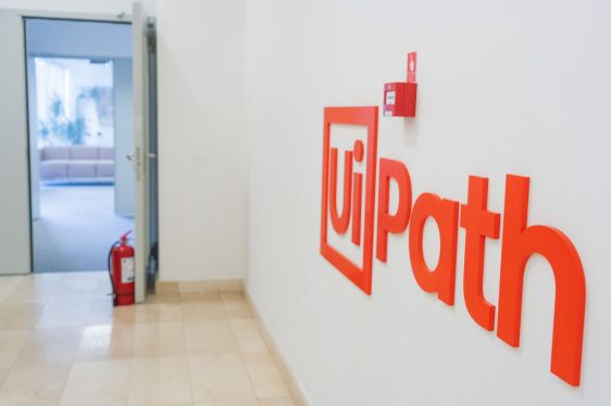 UiPath offices with logo on the wall.