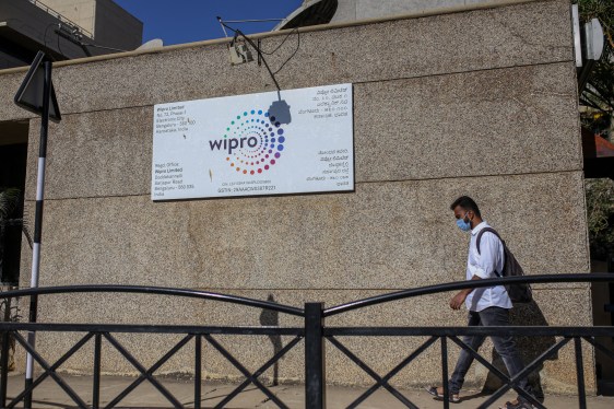 pedestrian passes a Wipro office