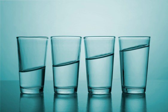 Image of a row of glasses with varying amounts of water they grow from empty to full.