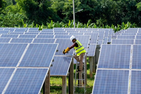 Engineers checking and repairing solar panel at generating power of solar power plant, used in post about Enact Systems