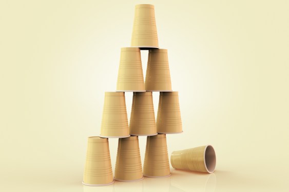 plastic cups stacked in a pyramid with one fallen down; supply chain risk