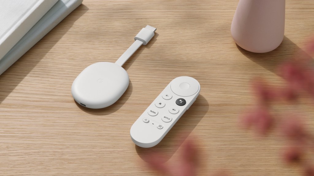 remote and Chromecast dongle on table