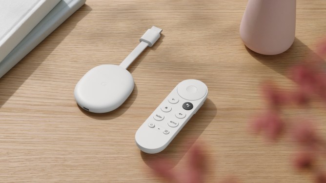 remote and Chromecast dongle on table