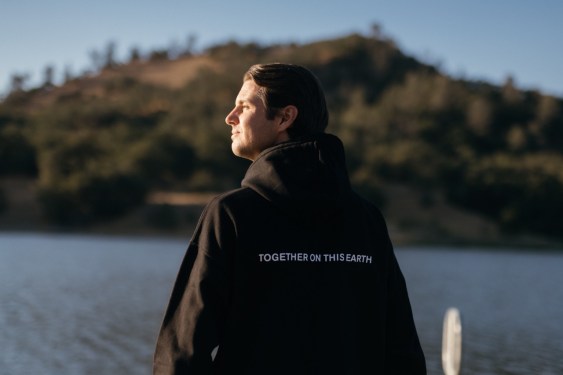 man at lake, staring wistfully to left
