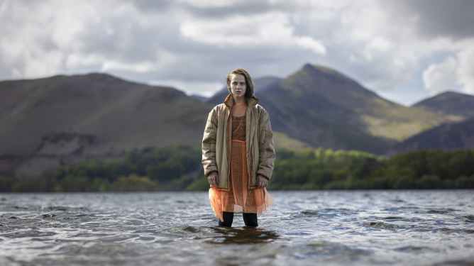 woman standing in lake