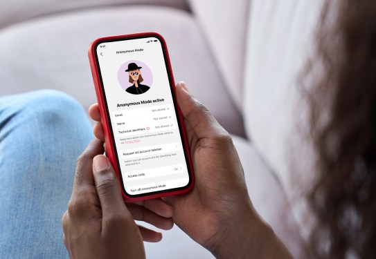 woman holding smartphone in hand
