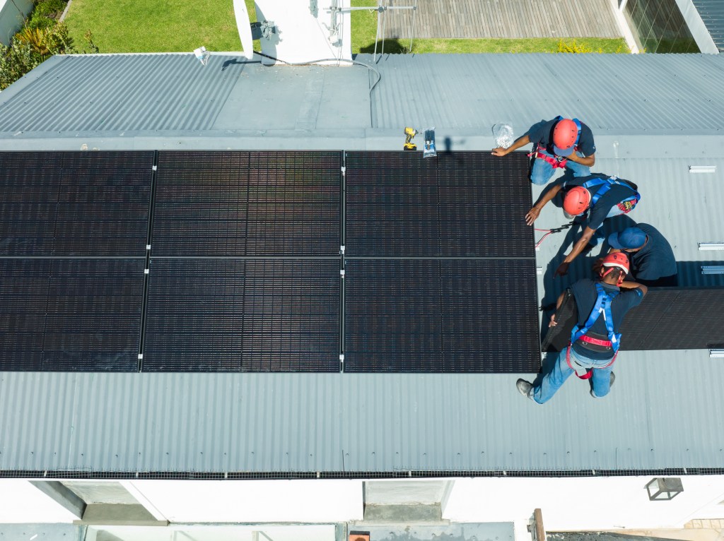 Solar panels being installed on a roof.