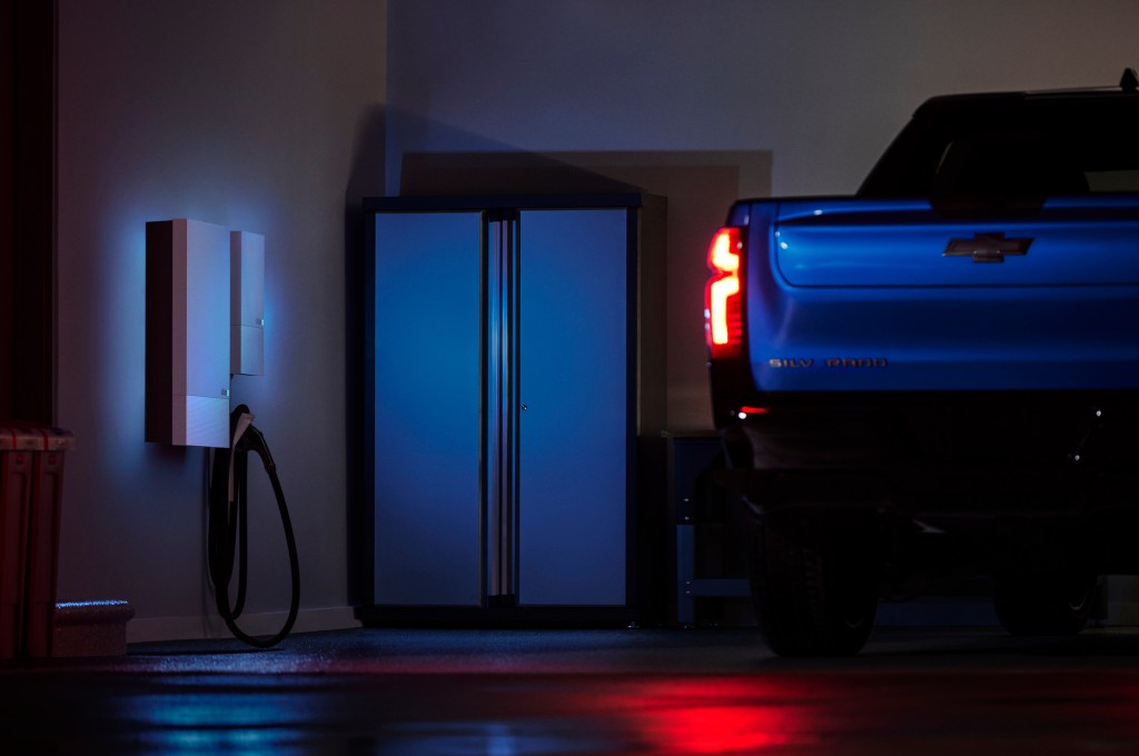 electric truck in garage with wall charging unit