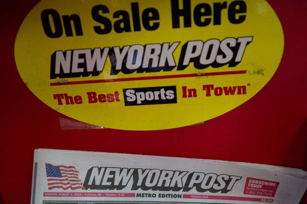 A copy of the New York Post on a news stand in New York City.