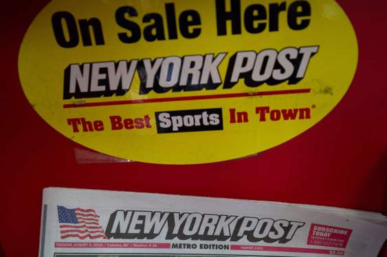 A copy of the New York Post on a news stand in New York City.