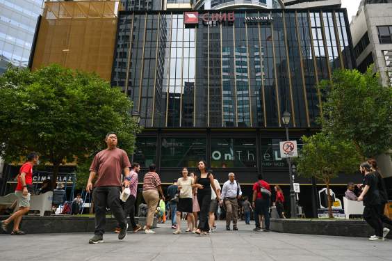 Office workers outside in financial business district in Singapore
