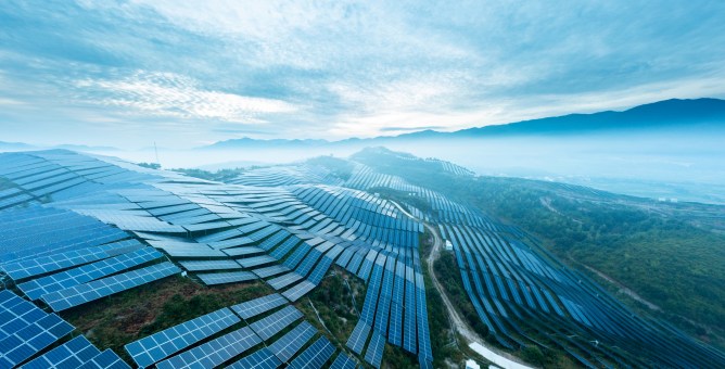 Aerial view of solar panels on a hill