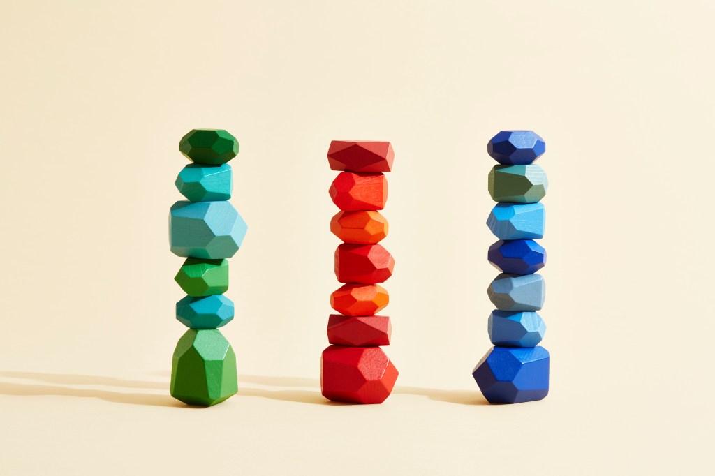 Three stacks of rocks in different colors