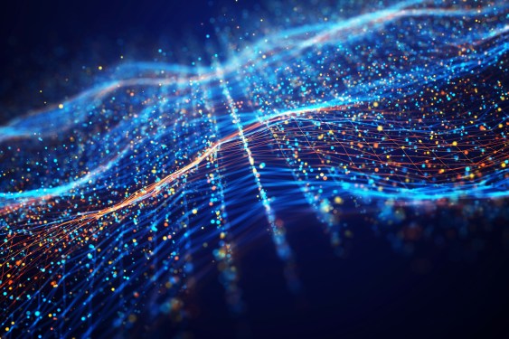 Abstract network wave and a glowing blue and orange particle data on dark background.