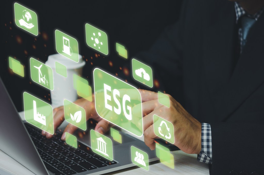 Businessman touching ESG Environmental Social Governance virtual screen Internet Business Technology Concept.
