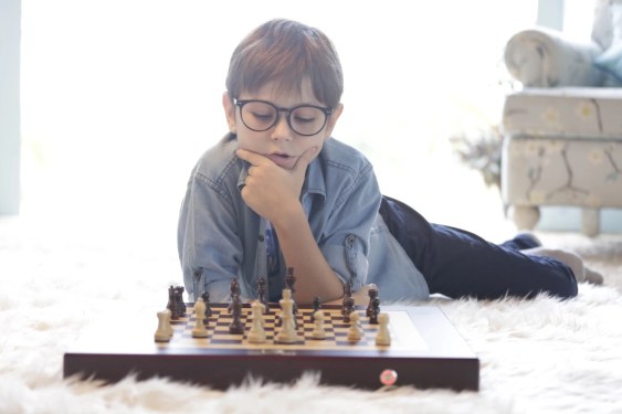 kid playing chess