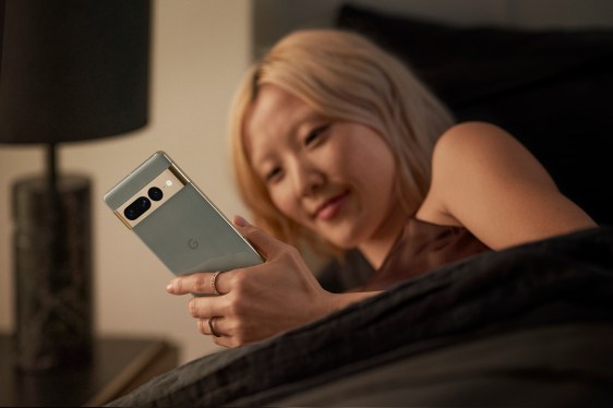 young woman staring at smartphone