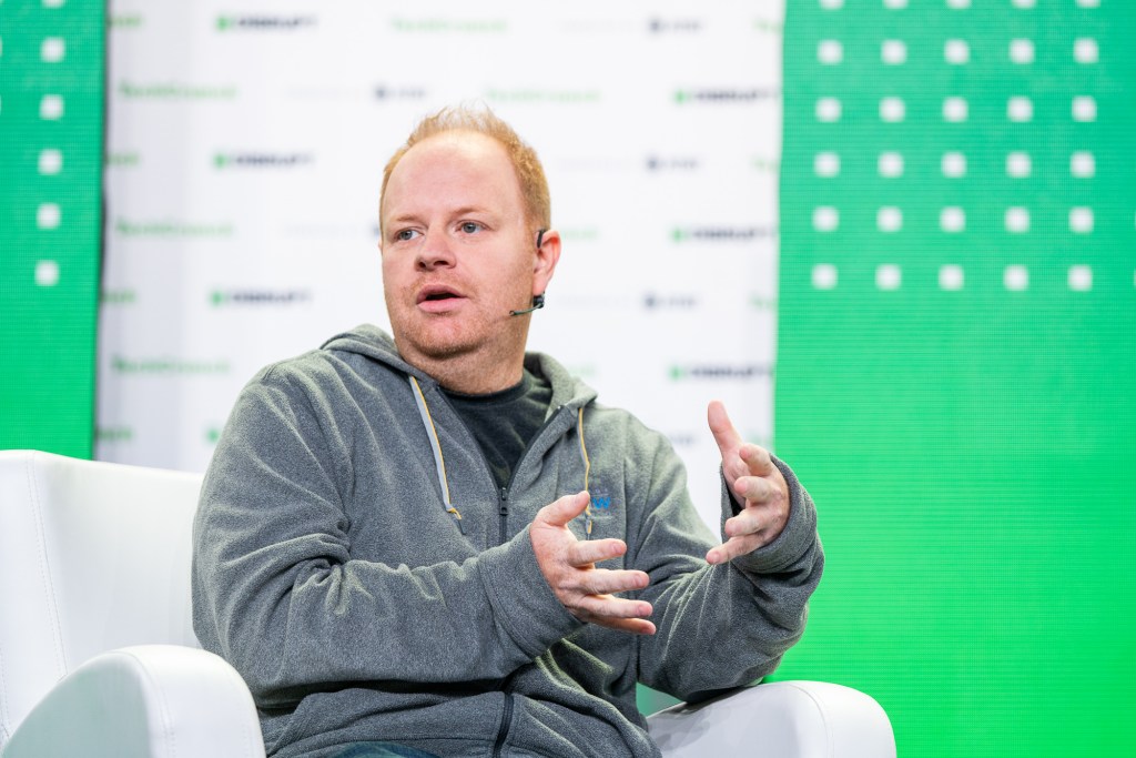 Parker Conrad, CEO at Rippling talks with Mary Ann Azevedo talk about "Going Global" at TechCrunch Disrupt in San Francisco on October 20, 2022. Image Credit: Haje Kamps / TechCrunch