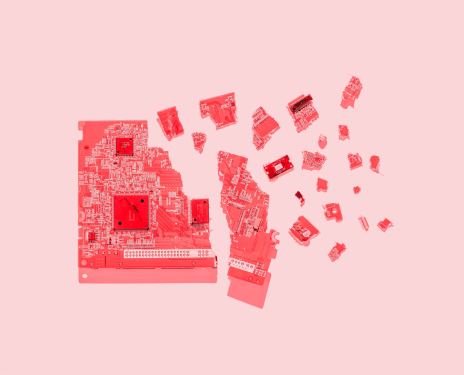 Broken circuit board tinted red.