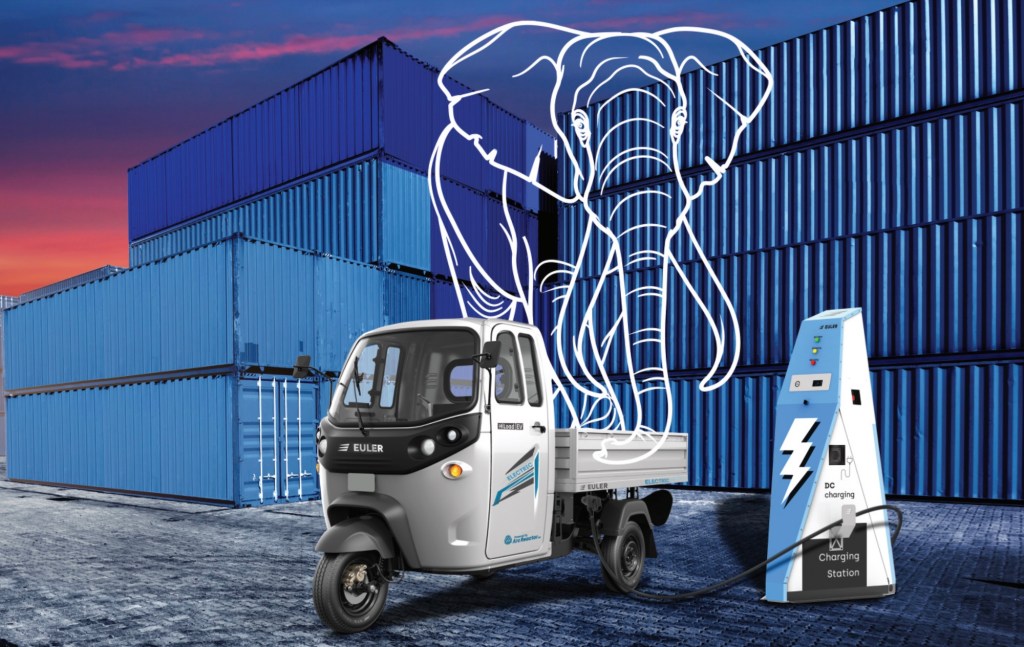 electric cargo three-wheeler parked in front of shipping containers