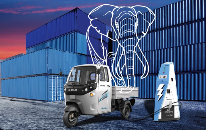 electric cargo three-wheeler parked in front of shipping containers