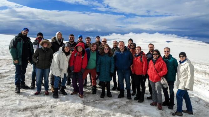 Group of people standing out in the snow