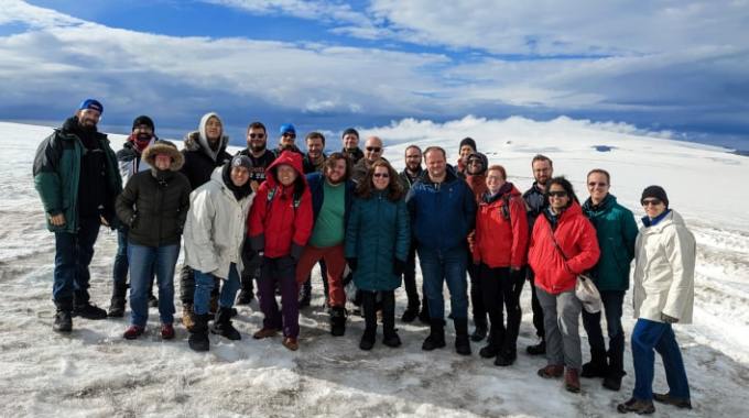 Group of people standing out in the snow