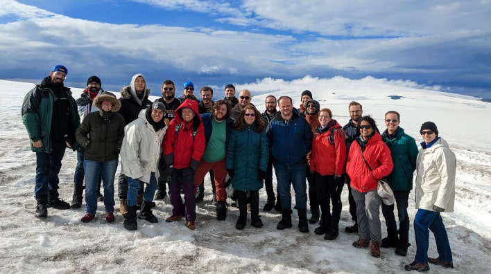 Group of people standing out in the snow