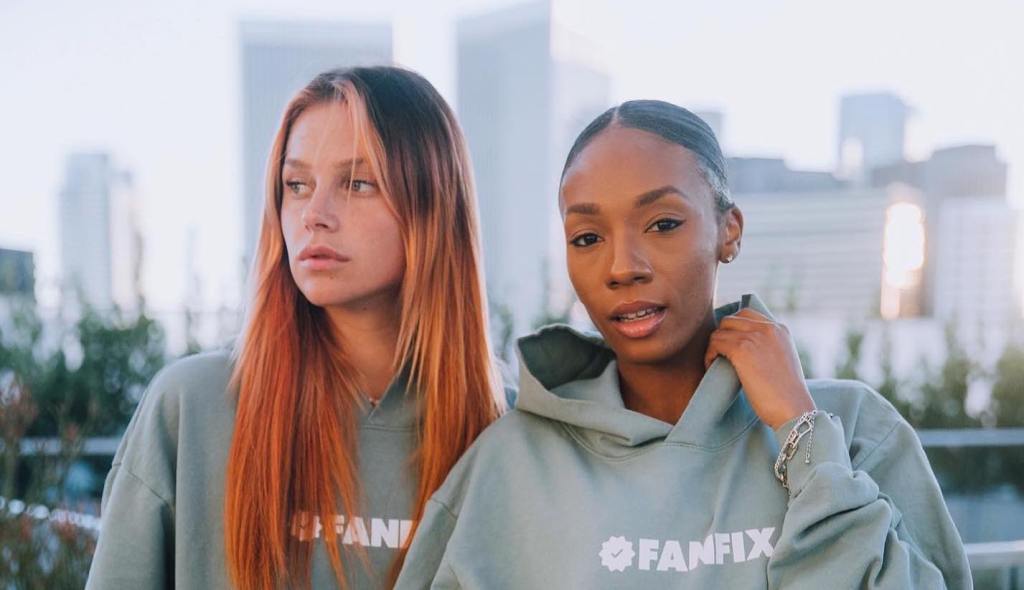 two women wearing Fanfix hoodies