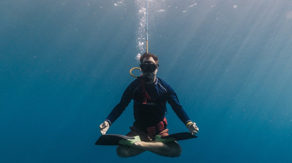 Diver in the water looking pretty zen
